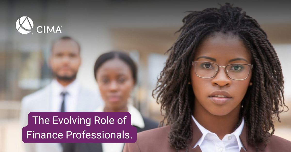 Young female finance professional zoomed in - in a group of 2 other finance professionals
